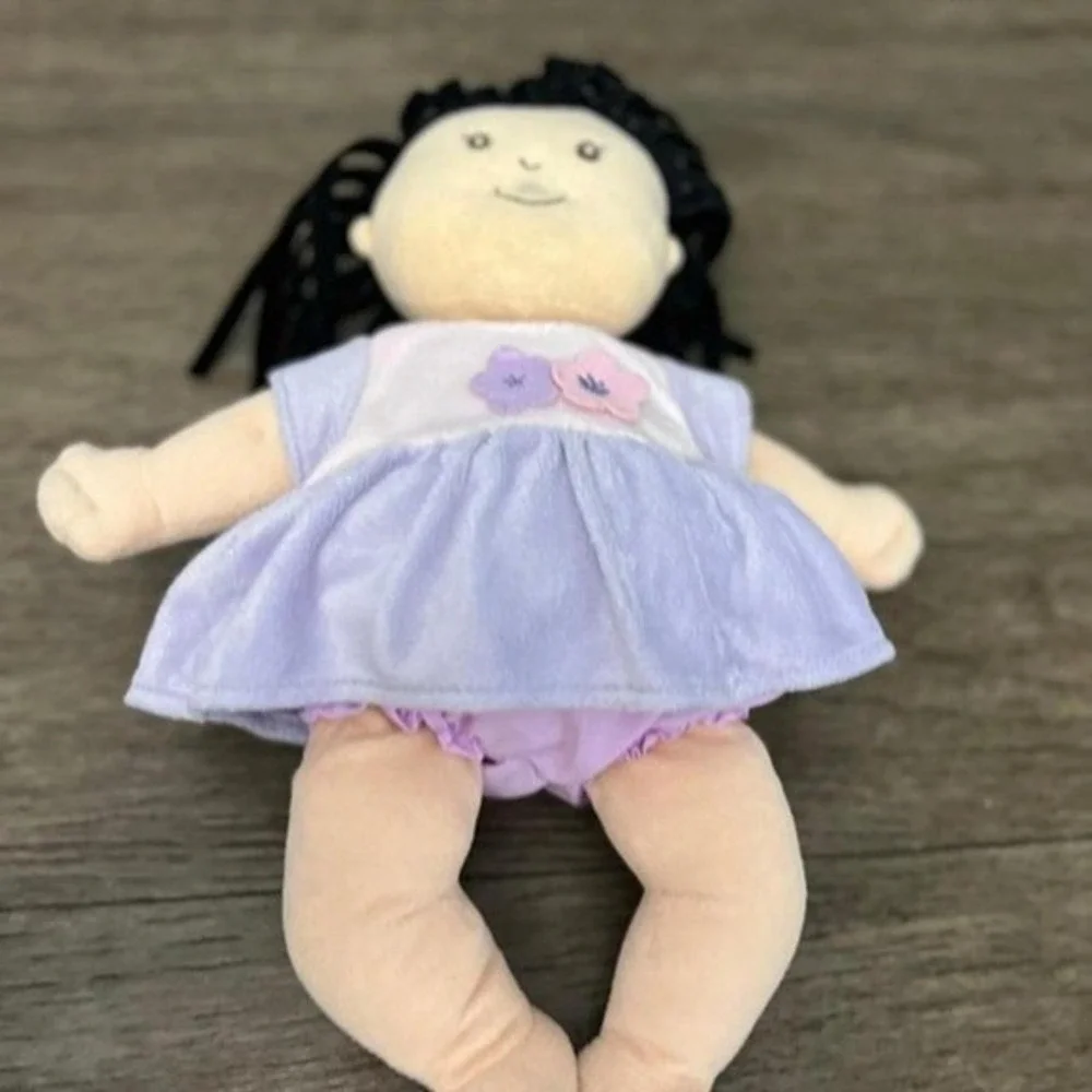 Manhattan Toy Co Baby Stella Doll Soft Plush Black Hair Purple Floral Dress Toy